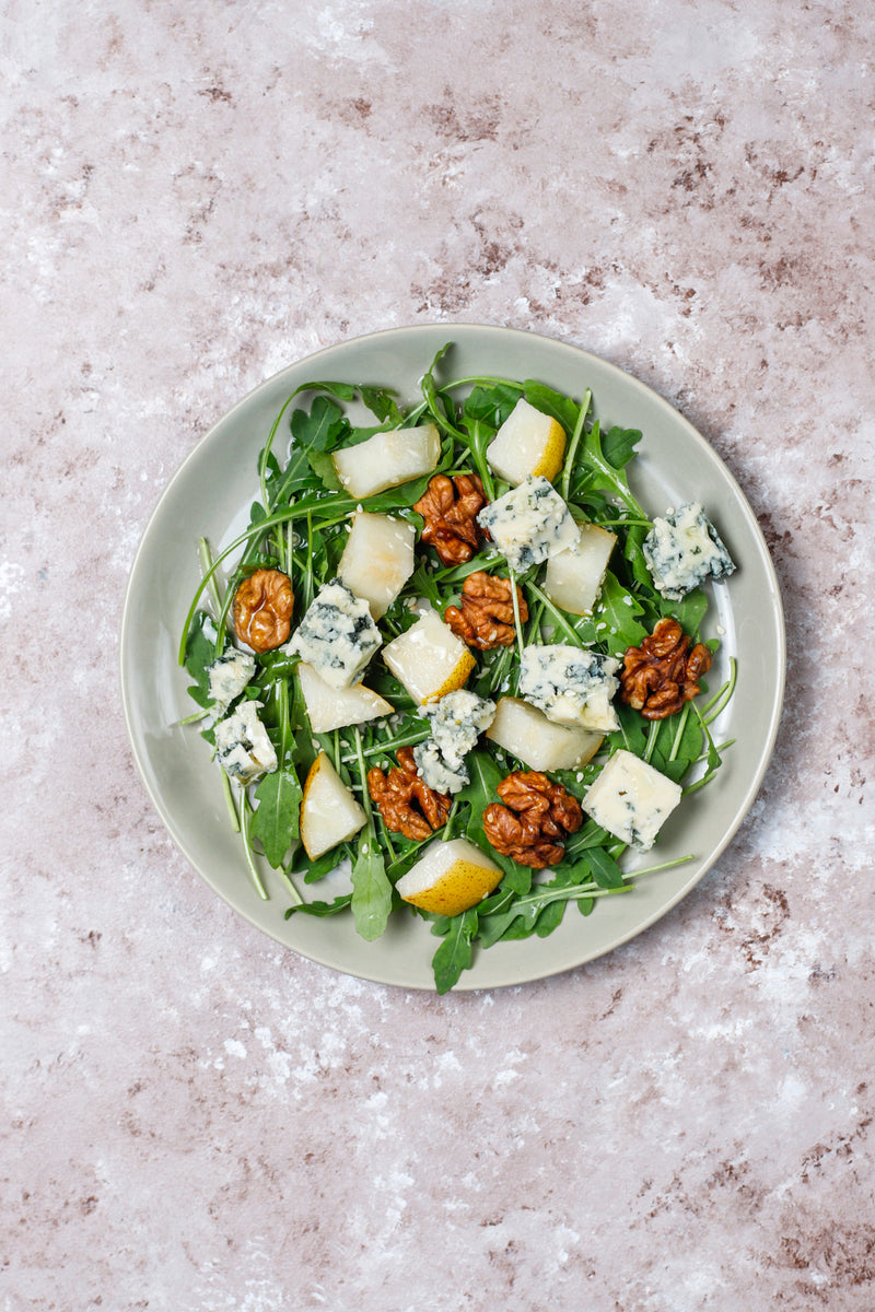 Rocket salad with dairy-free blue cheese and walnuts