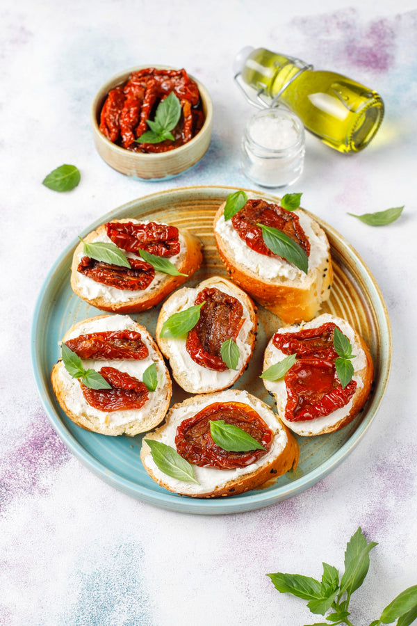 Toasts with almond cream and dried tomatoes
