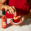 Close-up of sauce texture with chili and garlic flakes visible