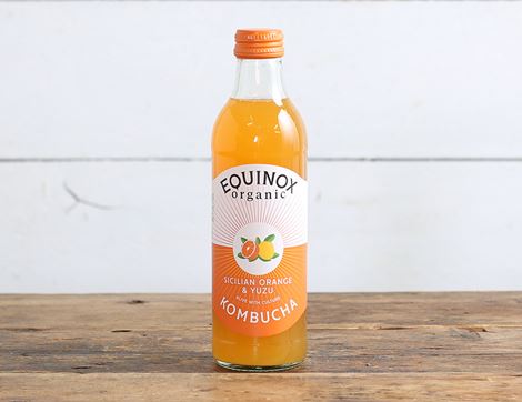 Organic kombucha with Sicilian orange flavor on white background