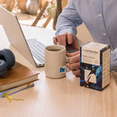 Steaming mug of brewed Pure Focus herbal tea with natural backdrop
