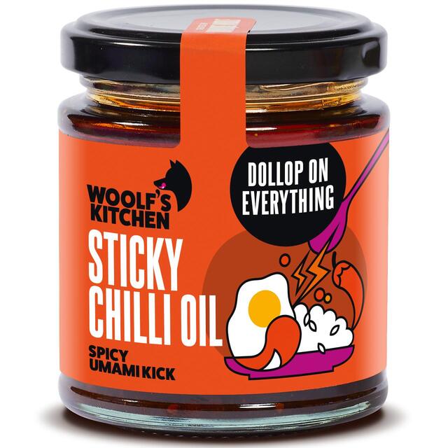 Sticky chilli oil in a glass jar with rich red chili flakes and glossy texture
