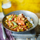 Payst Massaman Curry Paste stirred into creamy coconut curry with tofu