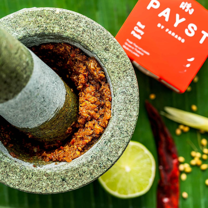 A bowl of Thai red curry made with Payst paste, featuring tofu and vegetables.
