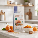 Chopped Apricots 500g pouch on a kitchen counter with a bowl of dried apricots