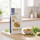 Organic Ground Coriander 250g pouch on a kitchen counter with ground coriander and seeds