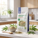 Organic Shelled Hemp Seeds 500g pouch on a kitchen counter with a bowl of hulled hemp seeds