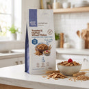 Toasted & Malted Wheat Flakes 500g pouch on a kitchen counter with a breakfast bowl
