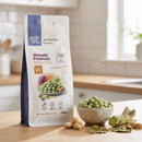 Wasabi Peanuts 250g pouch on a kitchen counter with a bowl of wasabi-coated peanuts