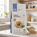 Organic Wheatgerm 1kg pouch on a kitchen counter with a bowl of wheatgerm
